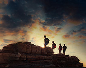 Eight people walking up a hill. God's remnant travelling to share God's Word